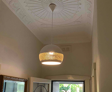 An intricate light hanging from the ceiling